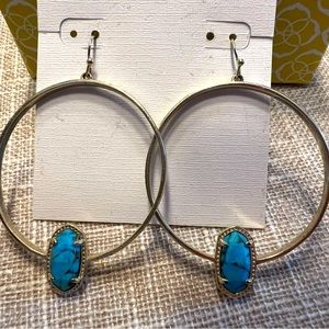 KS gold hoop earrings with aquamarine gemstones.